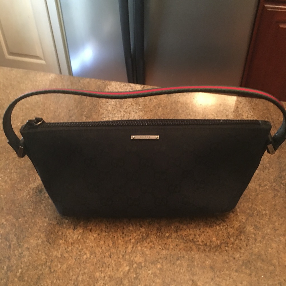 Authentic Gucci GG Black pochette comes with COA